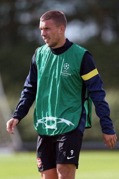 during a training session at London Colney on September 17, 2012 ahead of CL group stage match again