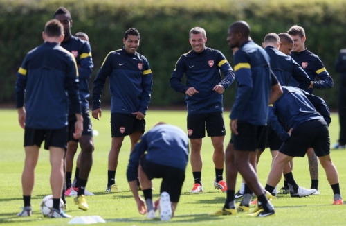 during a training session at London Colney on September 17, 2012 ahead of CL group stage match again