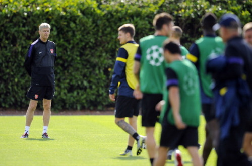 during a training session at London Colney on September 17, 2012 ahead of CL group stage match again