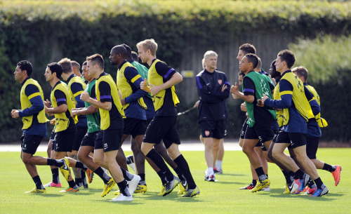 during a training session at London Colney on September 17, 2012 ahead of CL group stage match again