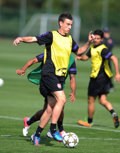 during a training session at London Colney on September 17, 2012 ahead of CL group stage match again