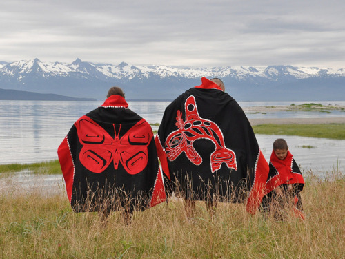 awakeningthunder:  DSC_0275 copy by alfie_price on Flickr.  The man in the middle is wearing a cloak EXACTLY like the natives who performed the totel pole raising ceremony I was a part of as a child