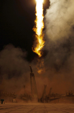 fuckyeahfluiddynamics:  A fiery jet of exhaust remains amid plumes of smoke as a Soyuz rocket lifts off from Baikonur Cosmodrome bound for the International Space Station. The lengthscales of such turbulence range from tens of meters to only millimeters,