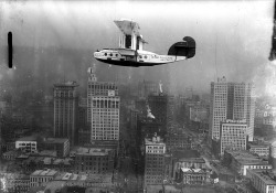 olddetroit:Commuter biplane flying over Detroit.