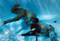 dogtagsandcombatboots:  Petty Officers 3rd Class Brandon McKenney and Randall Carlson assemble an M240G machine gun 15 feet underwater during the 4th Annual Recon Challenge at Marine Corps Base Camp Pendleton, Calif., Sept. 15, 2012. This year’s competito