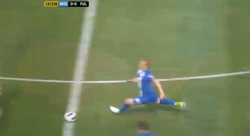  Premier League referee Lee Probert finds himself in the middle of a crunching tackle between Steve Sidwell and Gary Caldwell. 