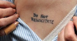 approachingsignificance:  82-year old Joy Thompkins with her “Please Turn Over” and “Do Not Resuscitate” tattoos she got after watching her husband’s slow painful death. Read more here and here. 