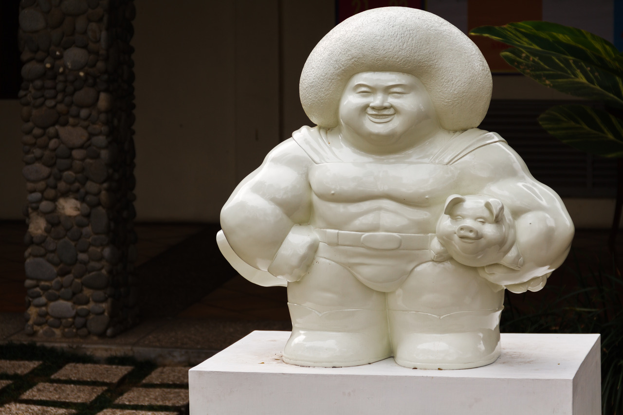 Fat Superman carrying a pig. The description said that the pig symbolizes capitalism