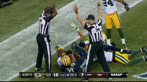 nfloffseason:  The stunning ending in Seattle. One ref raises his arms to signal touchback, the othe