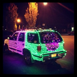 A car in the parking lot. Has animated bats and other animated Halloween on it! (Taken with Instagram)