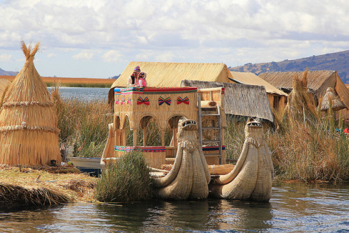 Uros traditional village on Lake Titicaca near the city of Puno, Peru (by m_c2012).