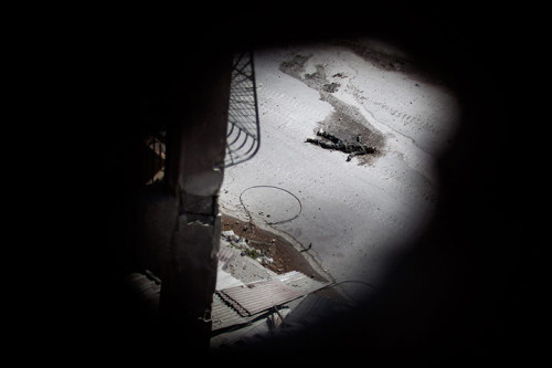 Aleppo, Syria: The body of a soldier lies on the street in Saif al-Dula district where government tr