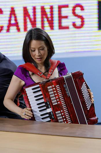 elle-lavender:  freckledhoney:  When I read that Lucy Liu played the accordion, I was like “yeah right!” But then I found these pictures and the following anecdote:  Greg Germann, who plays [Richard] Fish, Liu’s love interest on [Ally McBeal], is