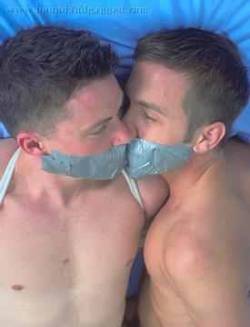 gaggedramdog:  Buddies tape gagged face to