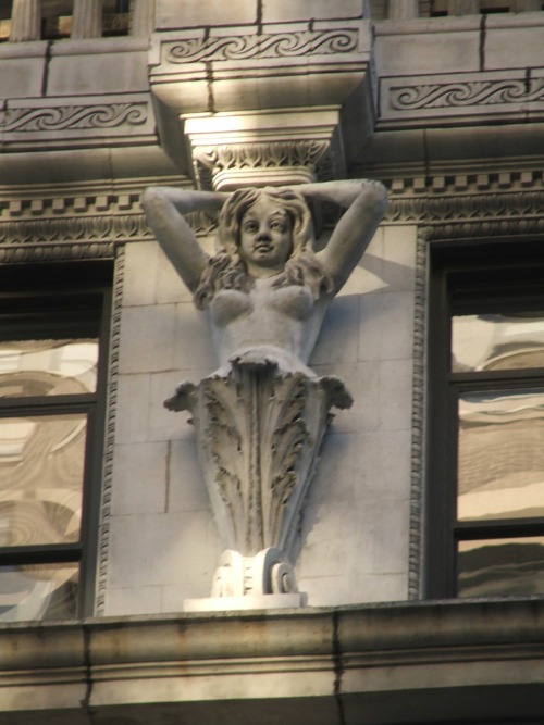 Architectural detailing on 91 Fifth Avenue, a Beaux-Arts loft completed in 1894, features a busty wo