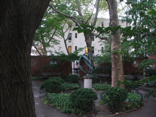 An armillary sphere sits in the .05-acre Winston Churchill Square Park located on Sixth Avenue betwe