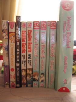 moniposas:  Sorry for the bad quality you guys ;~; But anyway, I’m doing my first giveaway! :D This is a collection of Shoujo manga books as listed: Books 3 &amp; 4, 11, 19 and Special Edition Fanbook of Fruits Basket by Natsuki Takaya Captive Hearts