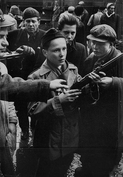 Hungarian Revolution of 1956Budapest boys from about twelve to late teens carrying rifles, to fight 