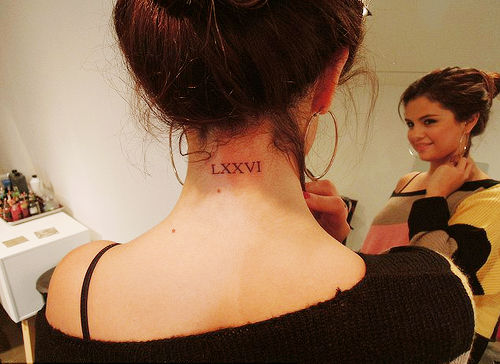 fuckyeahselenita:  Selena’s new tattoo that reads ‘76’ in roman numerals for