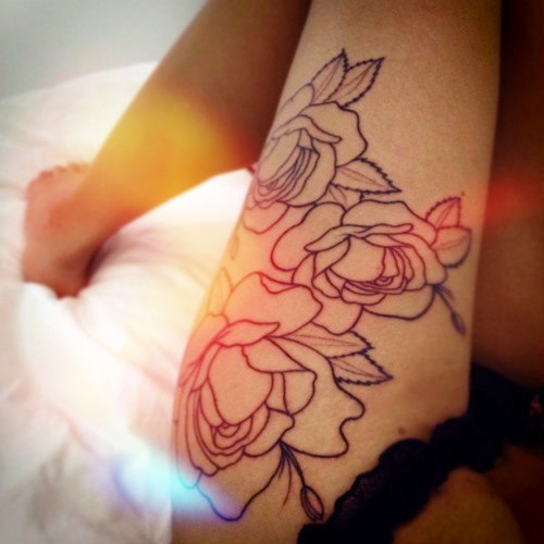 Upper arm rose tattoos for women