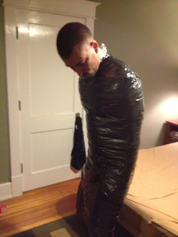 bondageman007:  It had been a wild night for Kenny. He woke up with a pounding headache. It wasn’t until he tried to get up that he noticed that his douche bag frat brothers had mummified him in several tight layers of duct tape. He noticed his dick