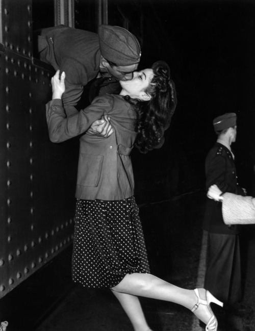 allaboutthepast:  From the window of a train, Private Joe Sunseri grabs a last minute kiss from his girl, Alma Teresi, March 1941 