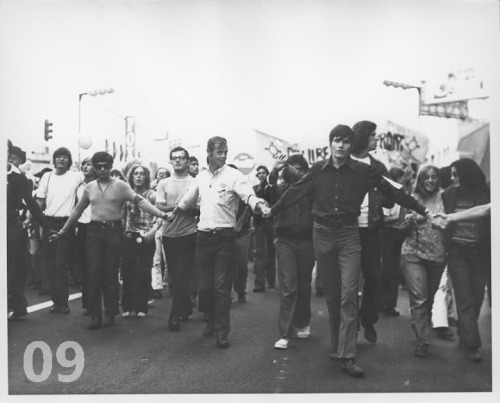 ineedtothinkofatitle:  10 Historical LGBT Moments Pictures courtesy of ONE National Gay & Lesbian Archives. 01. Police Officers Holding Hands At The Los Angeles Christopher Street West Pride Parade - 1972 02. Man Holds A ‘We Are Your Children’