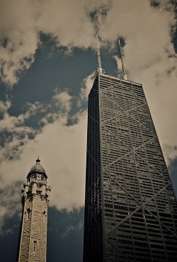 skyscraper:  james-the-analoger submitted:  Chicago  New and Old.  On the left is the Chicago Water Tower, a 47m stone tower built in 1869 to pump water from Lake Michigan. It was one of the few buildings in the area to survive the Great Chicago Fire