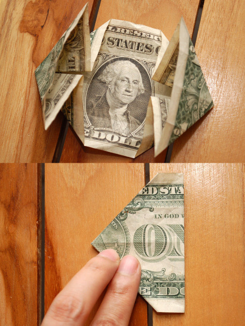 How to fold a dollar into the shape of a heart with a coin embedded.