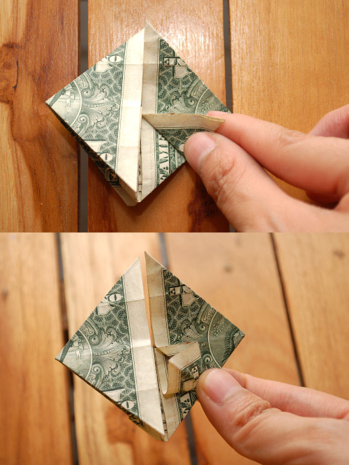 How to fold a dollar into the shape of a heart with a coin embedded.