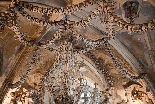 Skeleton decorations inside Sedlec Ossuary in Kutná Hora, Czech Republic (by halvorbodin).