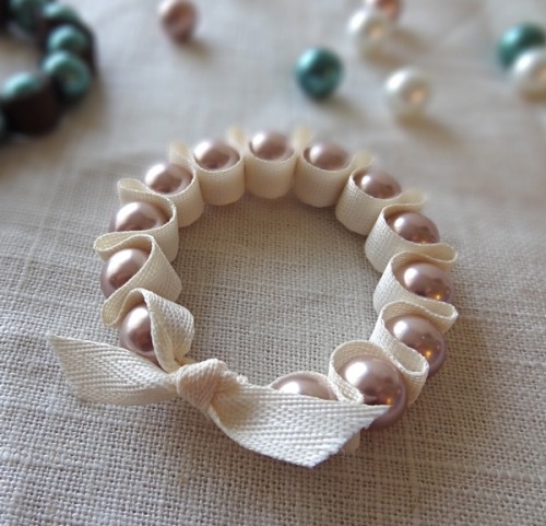 DIY Three Ribbon and Pearl Bead Bracelet Tutorials from Twinkle and Twine here. There are three styl