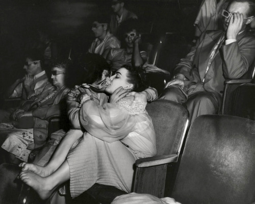 Couple kiss during 3D film; photo by Weegee.