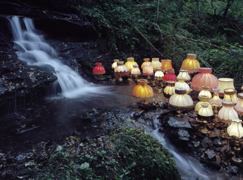 o-dyssea:  the-iridescence:  Norwegian conceptual artist Rune Guneriussen explores a fascinating balance of human culture and nature with his outdoor installations of electric lamps, stacked books, chairs, and phones that appear to have gathered in