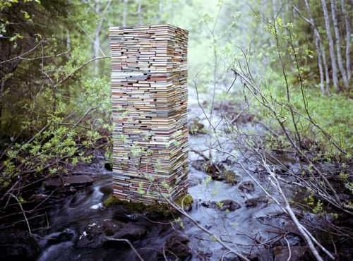 o-dyssea:  the-iridescence:  Norwegian conceptual artist Rune Guneriussen explores a fascinating balance of human culture and nature with his outdoor installations of electric lamps, stacked books, chairs, and phones that appear to have gathered in