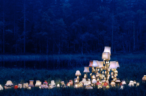 o-dyssea:  the-iridescence:  Norwegian conceptual artist Rune Guneriussen explores a fascinating balance of human culture and nature with his outdoor installations of electric lamps, stacked books, chairs, and phones that appear to have gathered in