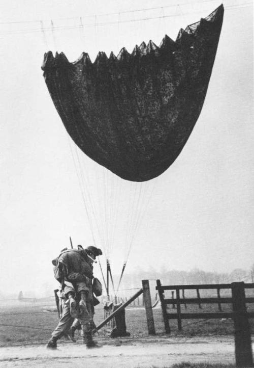 operationbarbarossa:A US paratrooper helping a wounded comrade to a nearby aid station - 24 March 19