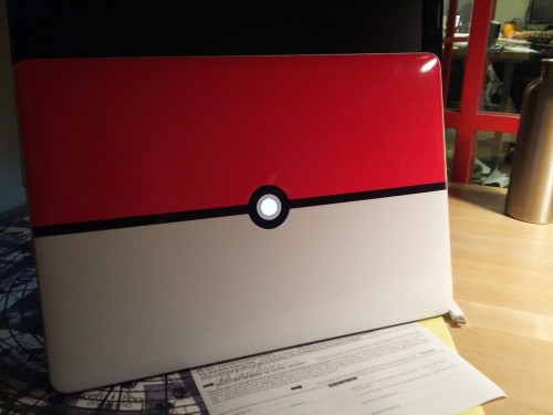 sardonicheight:  So I made a custom Pokéball skin for my MacBook Pro. I lined everything up and manually cut the circle out of the middle. Now, when you open the laptop (and the backlight is on), the circle glows. I’m pretty happy with it. ^^ 