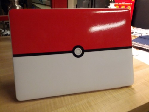 sardonicheight:  So I made a custom Pokéball skin for my MacBook Pro. I lined everything up and manually cut the circle out of the middle. Now, when you open the laptop (and the backlight is on), the circle glows. I’m pretty happy with it. ^^ 
