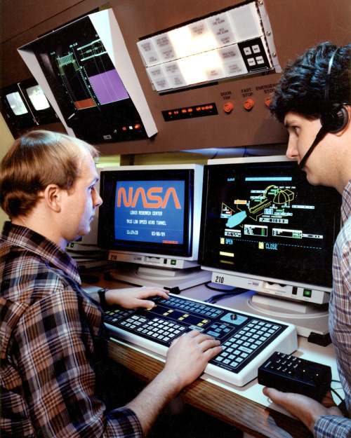 Control room. Text on the left side monitor: NASA Lewis Research Center 9X15 LOW SPEED WIND TUNNEL. 