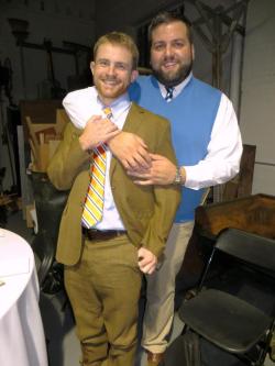 allabitfuzzy:  Bill and I at the rehearsal dinner on Friday :-)  He’s so adorable and professorial in that sweater vest! (It was held in a community art space, hence the apparent refuse in the background)