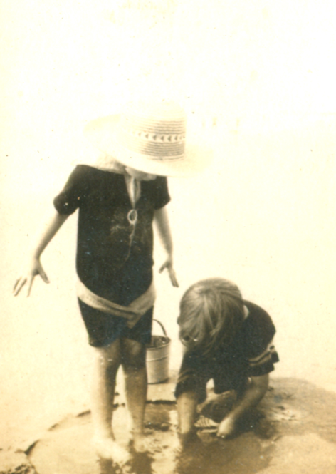 my grandma (and sibling?) at the beach (c. 1920s)