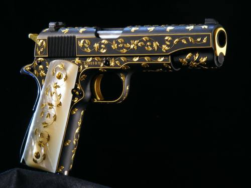 dirty-ghouls: aholyroman: Beautifully engraved 1911 Colt engraved gold inlay