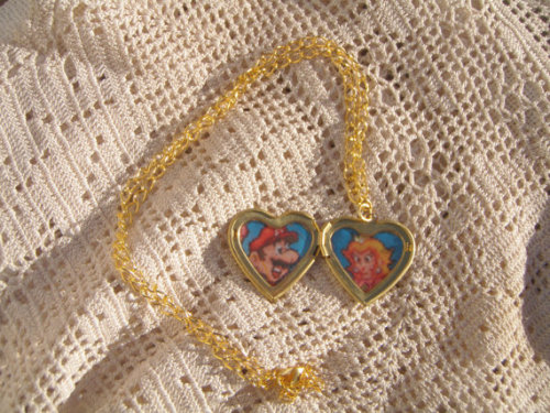 Sorry Mario but our princess is in…THIS LOVE HEART LOCKET! Available at https://www.etsy.com/