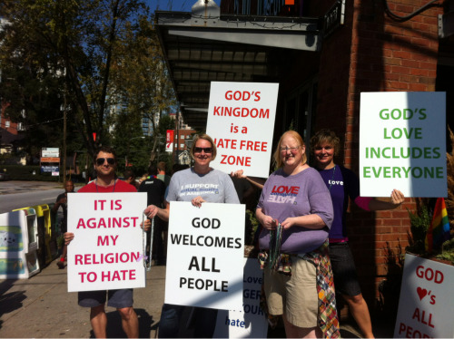 iheartkissingboys: Pro-Gay religious counter-protesters at Atlanta Pride. Faith in humanity - restor