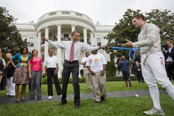 apoc20:  The President of the United States, the most powerful man in the world, is fencing with a lightsaber. That is all.