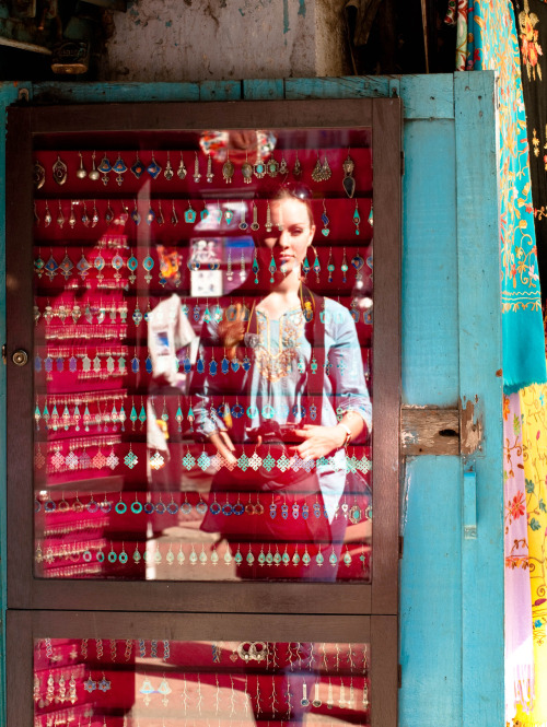 Me reflected in an earring display case in Thamel, Kathmandu, Nepal. Photography by BrookR
