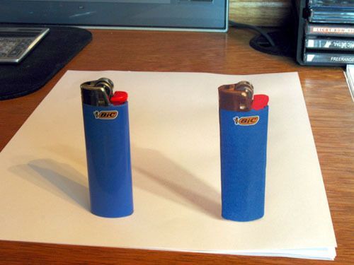 beinglazyisaskill:  artsyfartsyana:  warpedvamp:  pinklotusflowers:  The lighter on the left is real and the one on the right is drawn on paper in a 3D style. Very cool.  FUCK  NOPE   you artistic mother fucker 