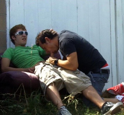  Sucking his buddy’s cock outside behind the shed. 