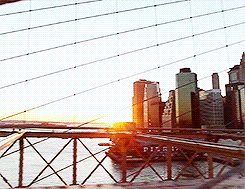   Over the great bridge, with sunlight through the girders making a constant flicker